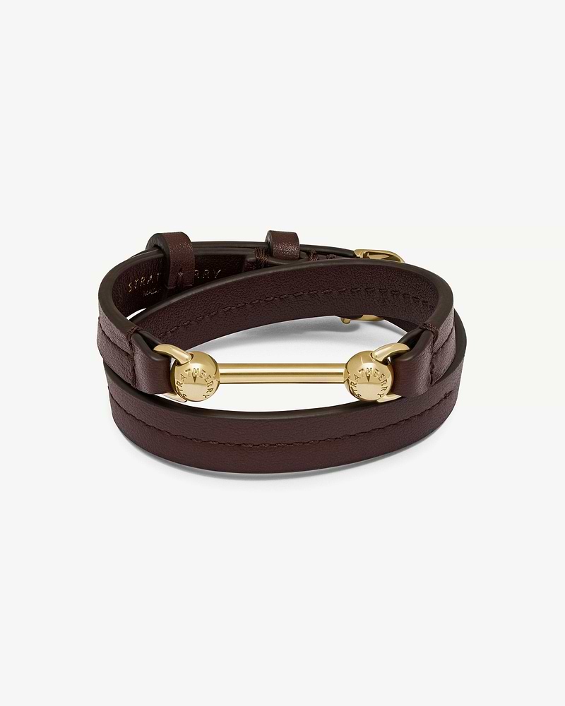 Burgundy double-wrap leather bracelet with gold Strathberry bar hardware and stitched edges.