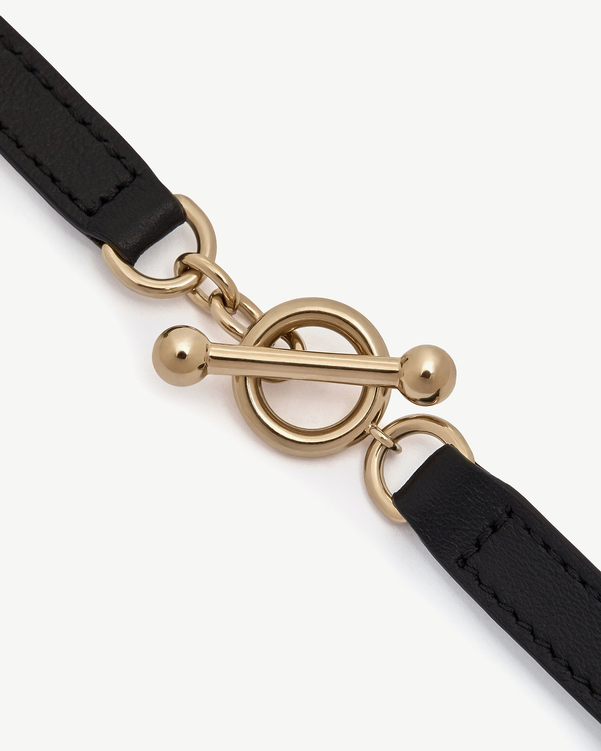 Black leather kite bracelet with gold toggle clasp and ring