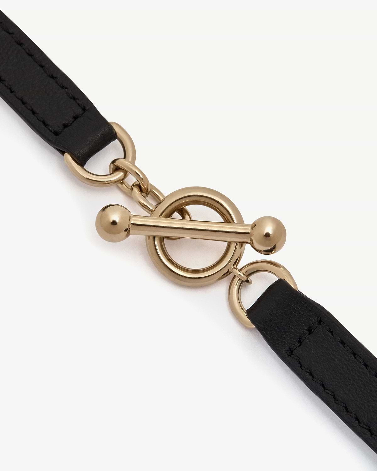Black leather kite bracelet with gold toggle clasp and ring