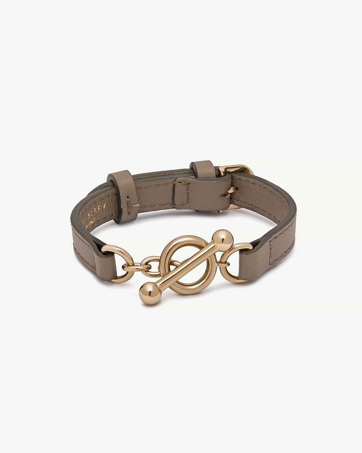 Strathberry taupe leather bracelet with gold circular toggle clasp and adjustable strap