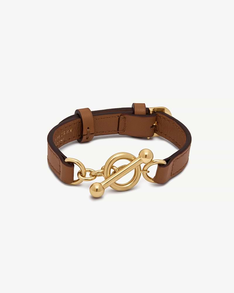 Tan leather bracelet with gold toggle clasp and circular chain links