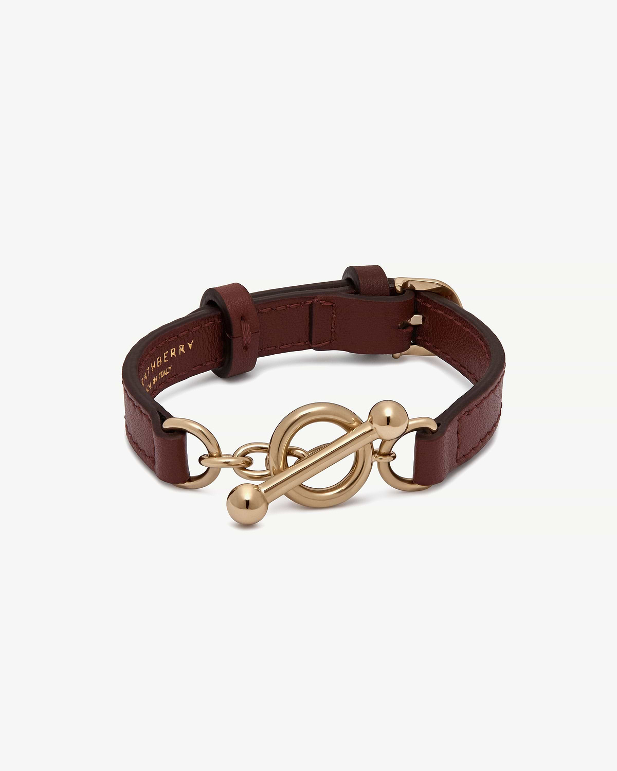 Oxblood leather kite bracelet with gold-tone toggle clasp and adjustable strap.