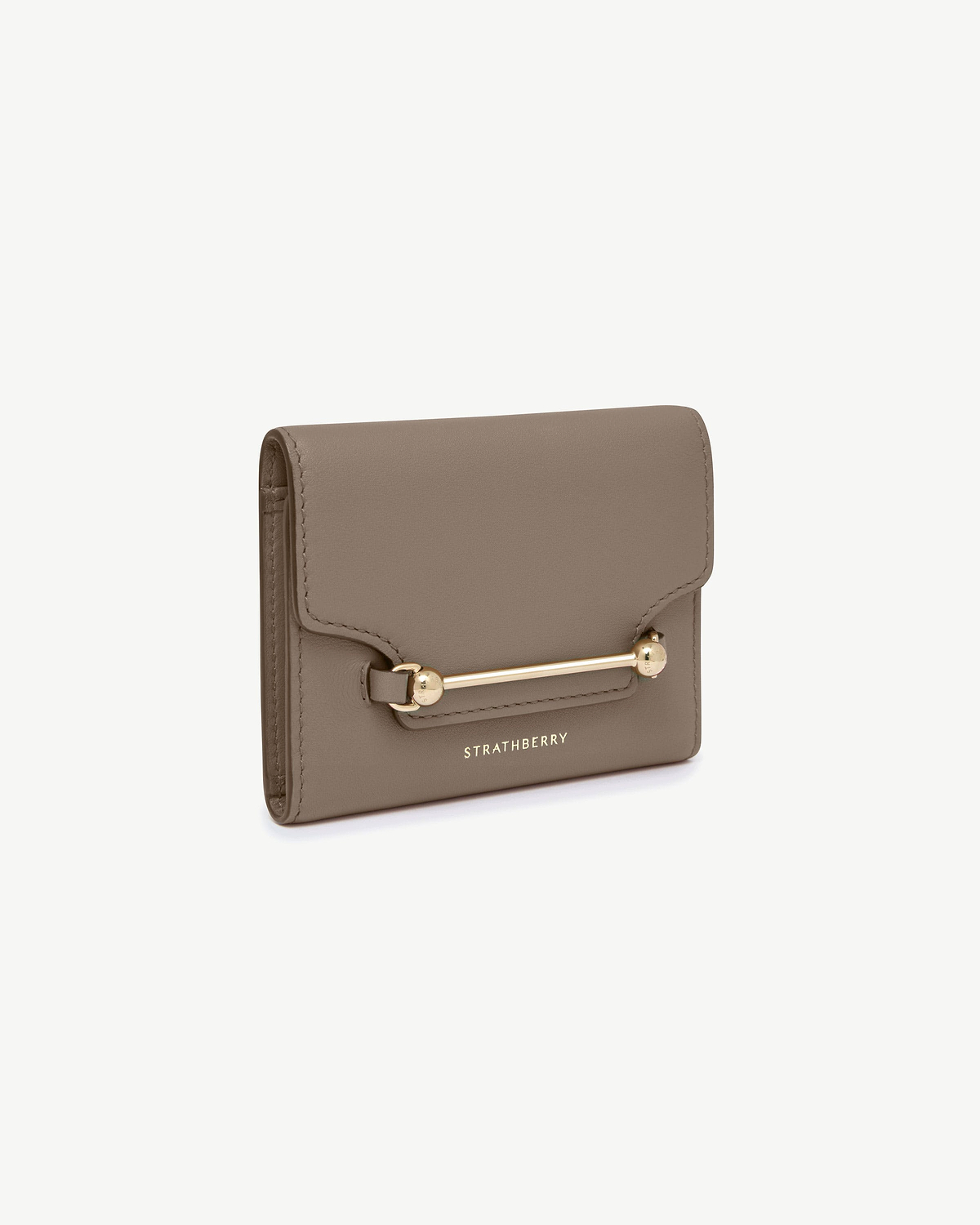Taupe Multrees trifold wallet with gold bar hardware and Strathberry logo.