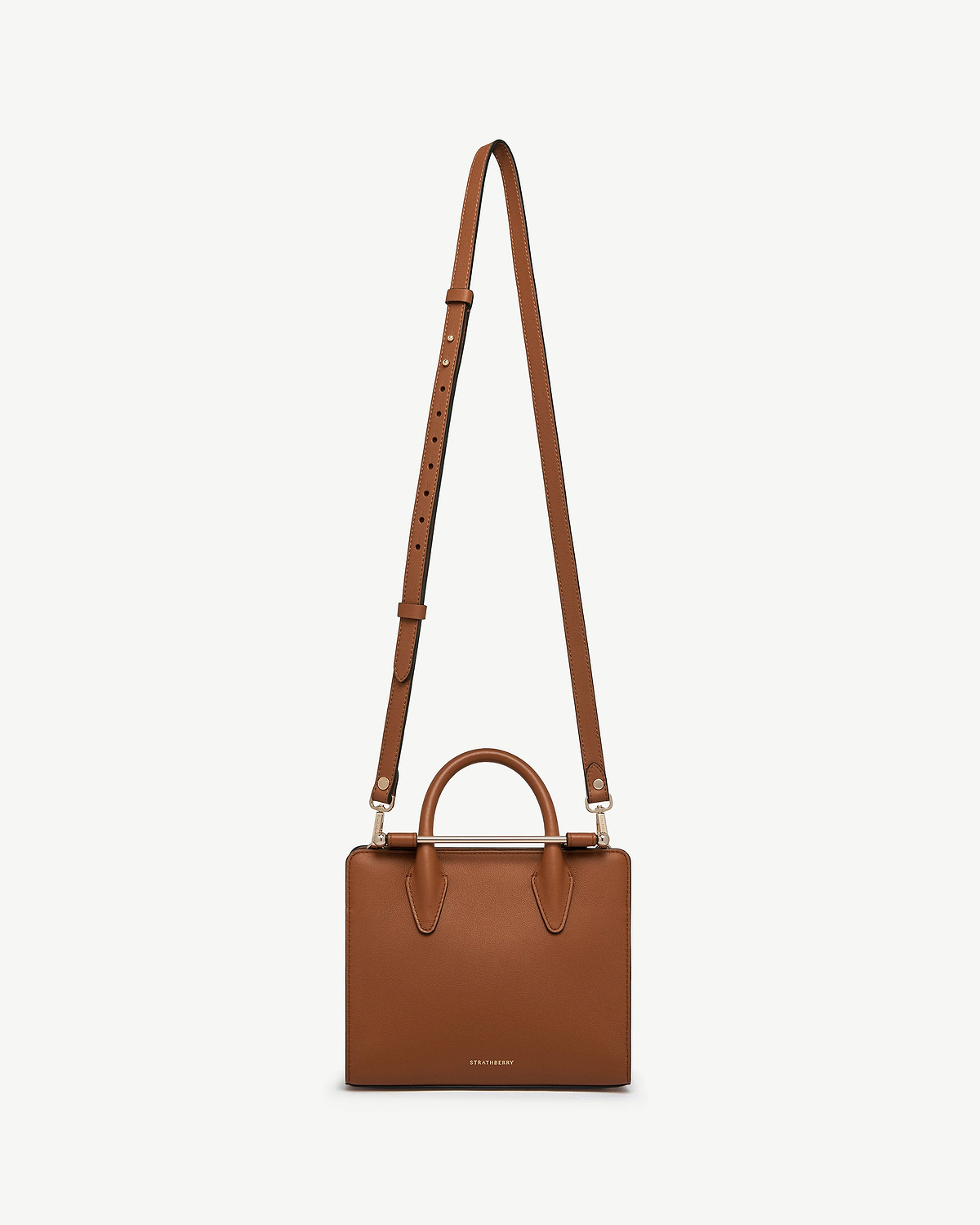 Chestnut thin adjustable leather strap attached to a Strathberry chestnut box bag.