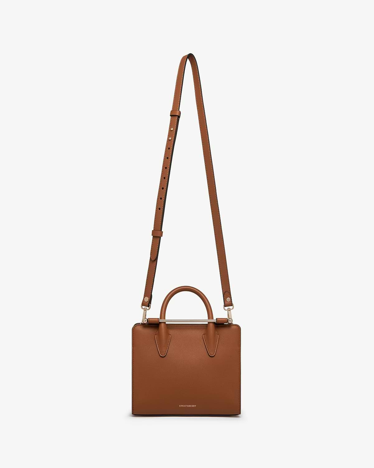 Chestnut thin adjustable leather strap attached to a Strathberry chestnut box bag.
