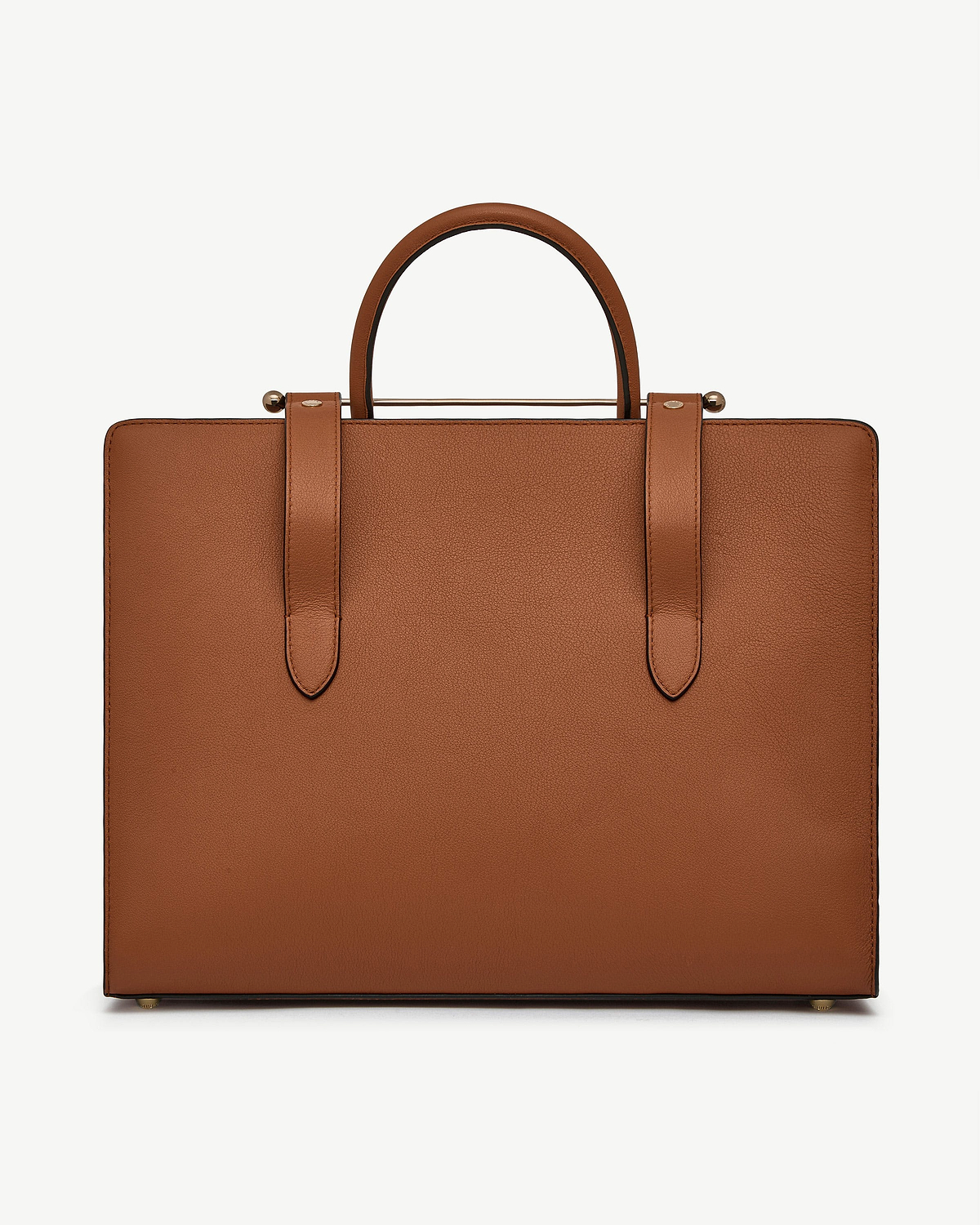 Chestnut leather tote with rounded top handles and strap details.