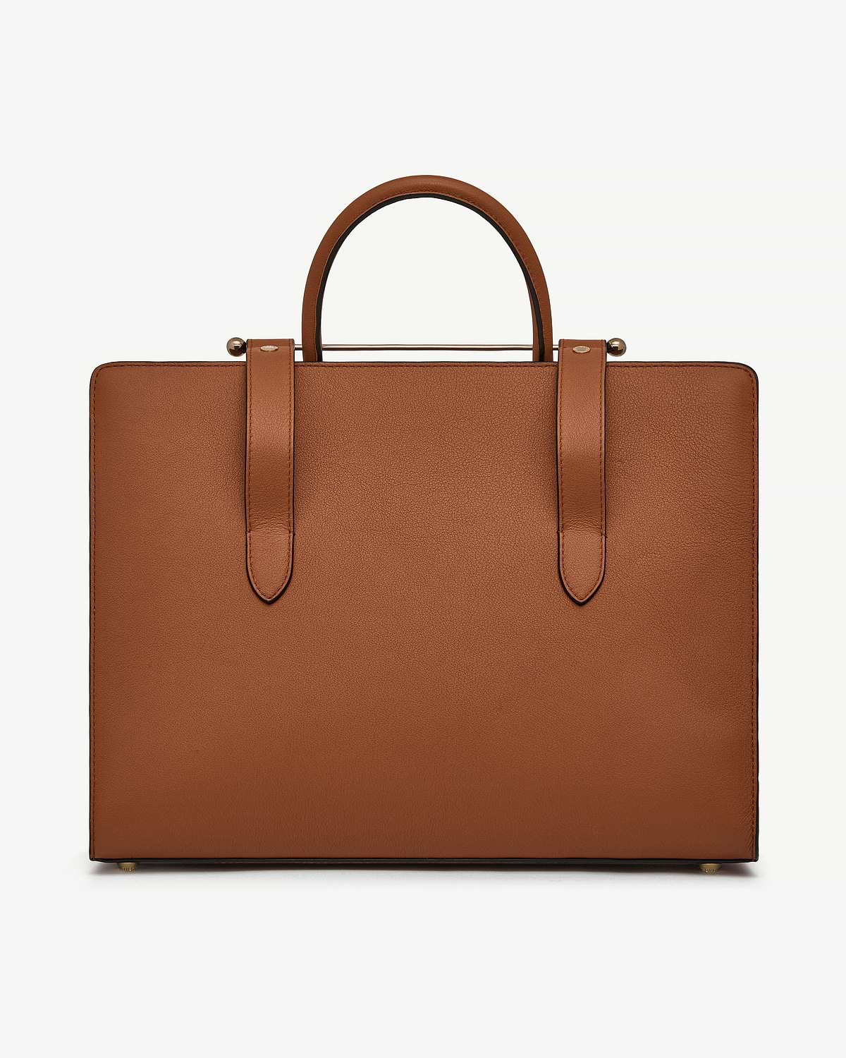 Chestnut leather tote with rounded top handles and strap details.