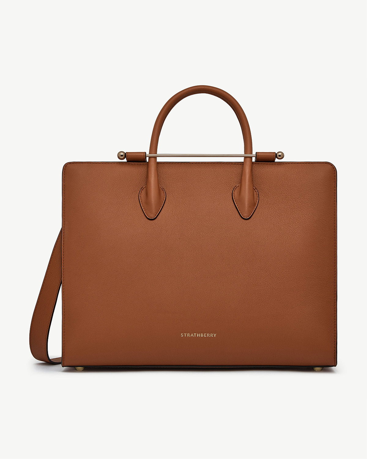 Chestnut leather tote bag with top handles, gold metal bar, Strathberry logo.