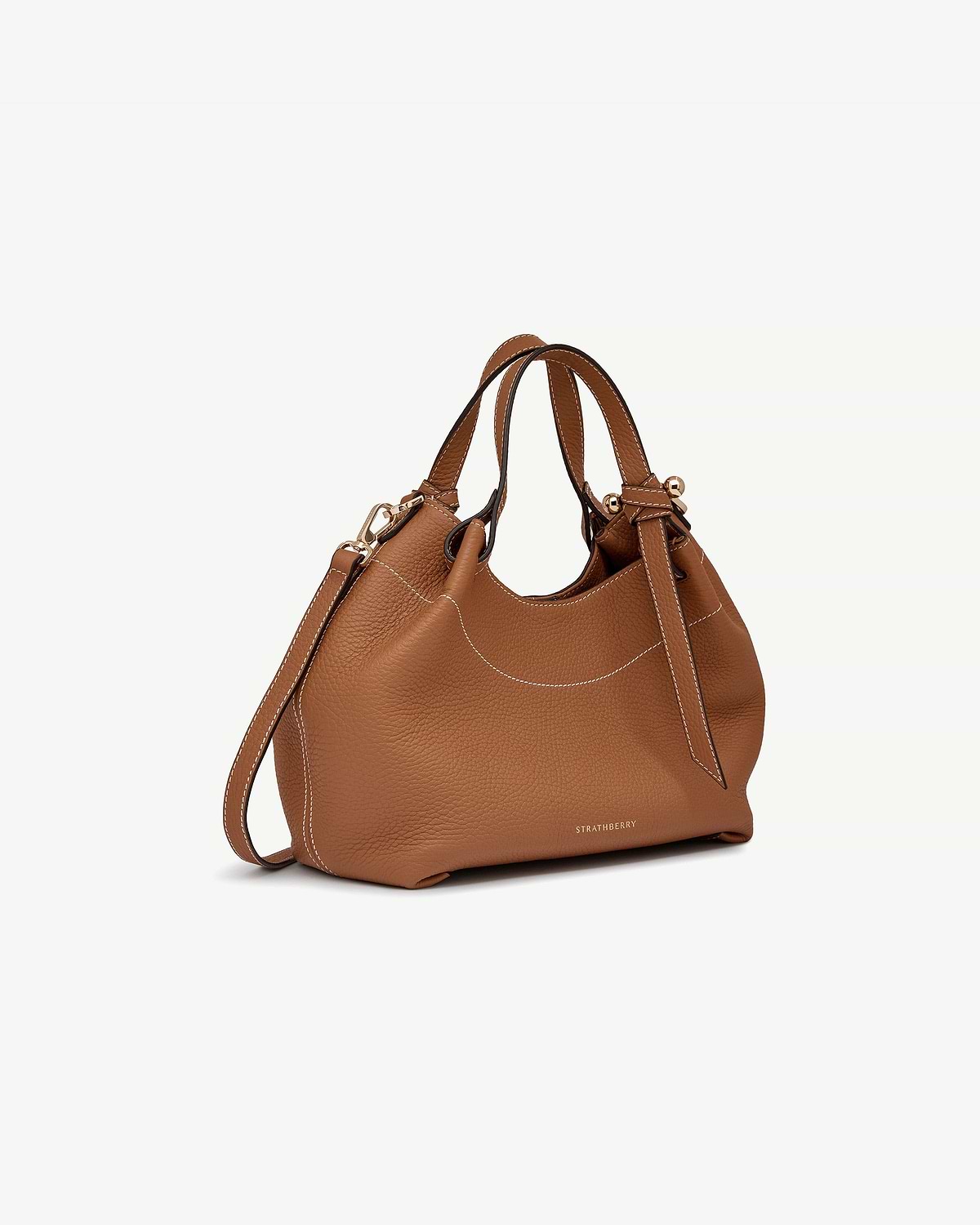 Tan Barra Mini leather bag with top handles, shoulder strap and Strathberry logo.