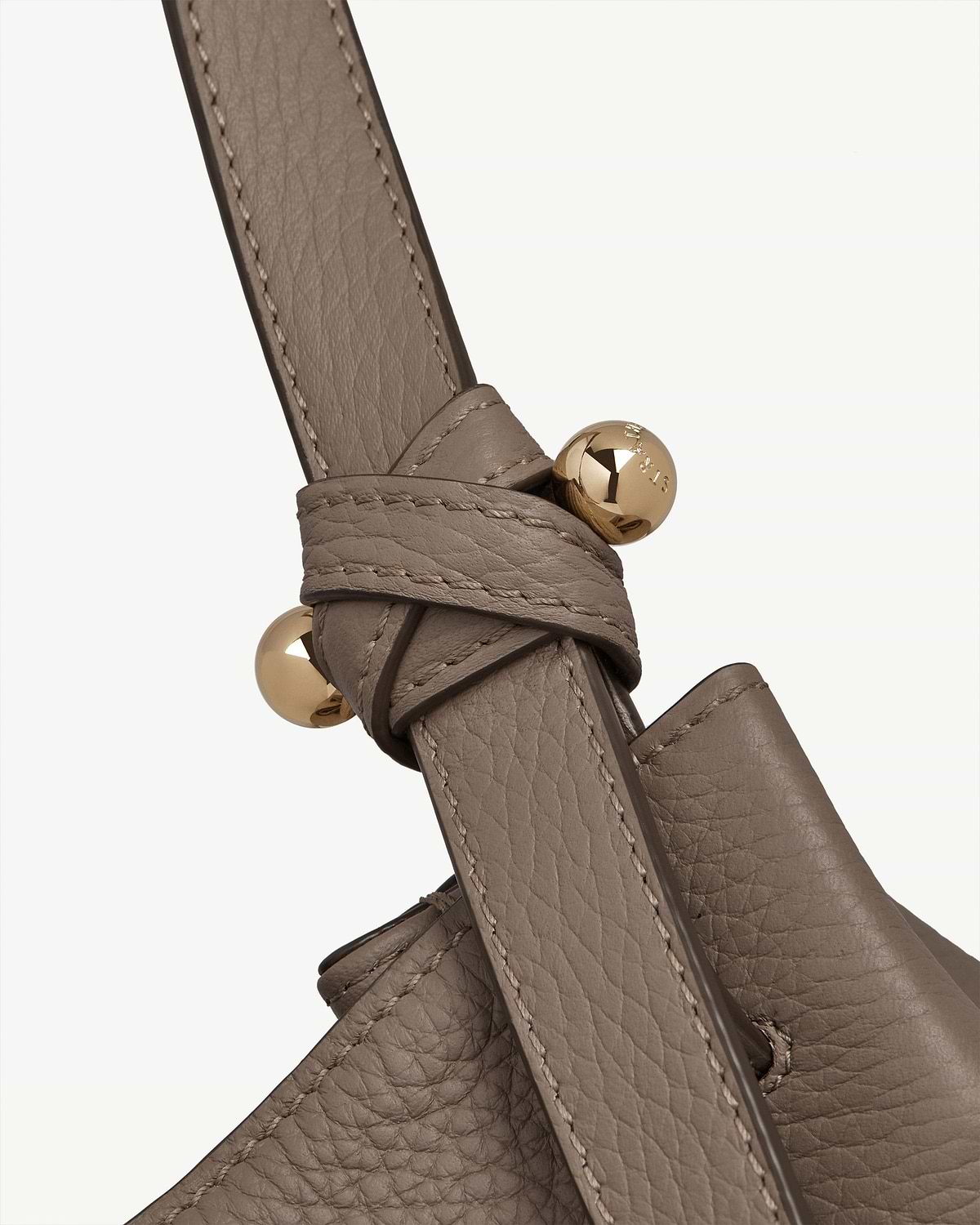 Taupe Barra tote leather strap knot with gold Strathberry stud.