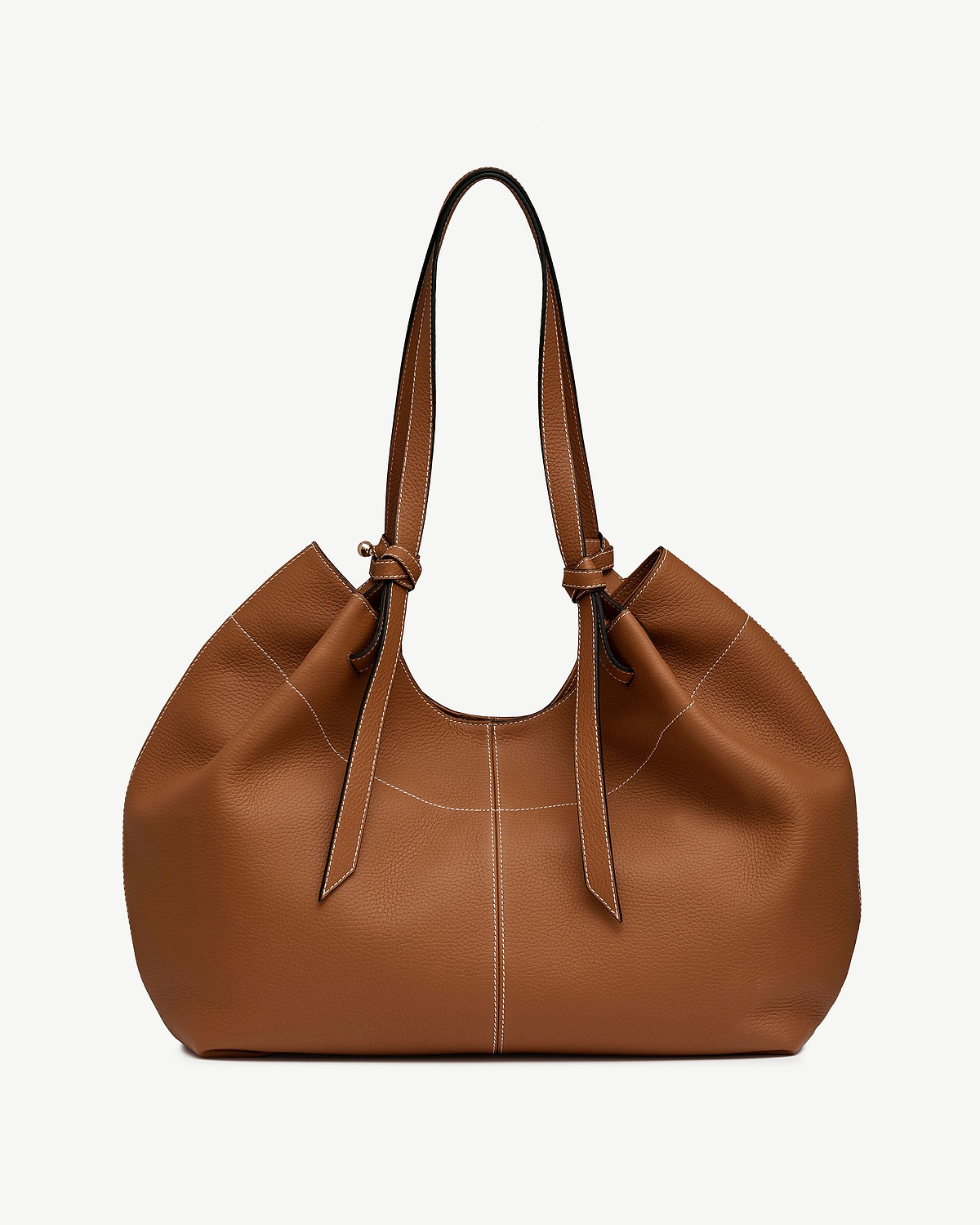 Tan leather tote bag with knotted handles and contrasting white topstitching.