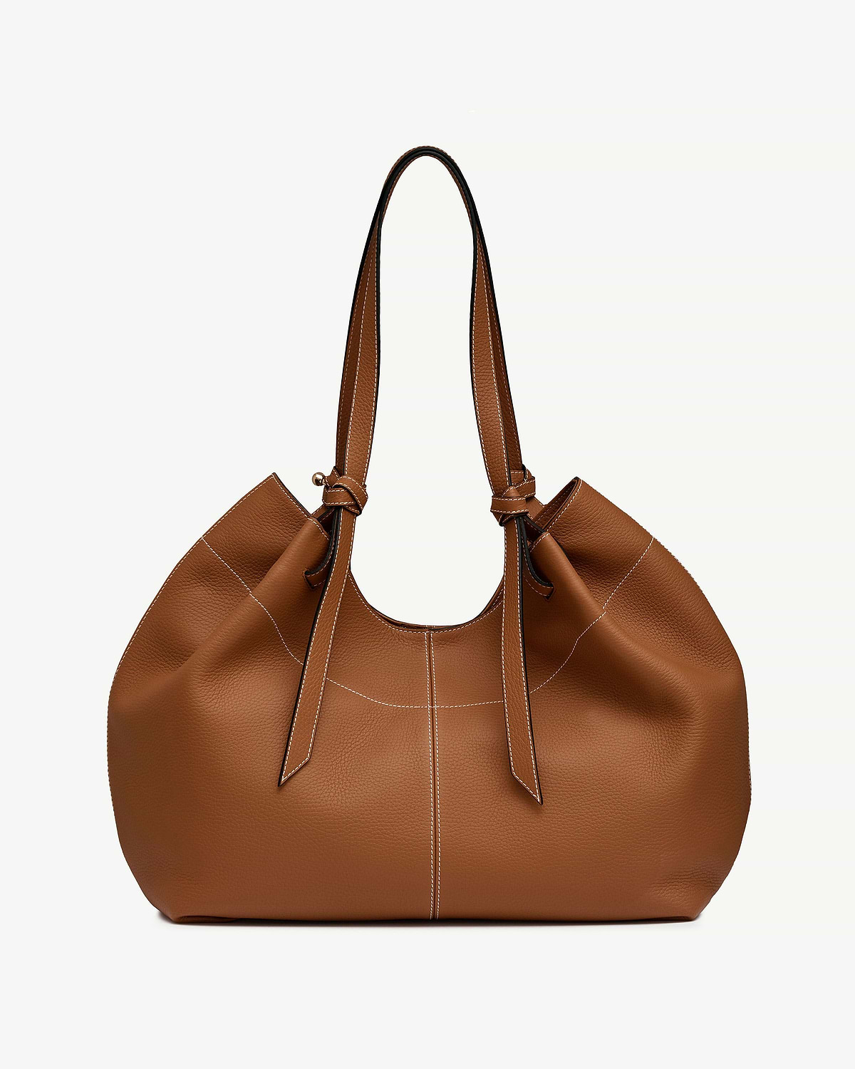 Tan leather tote bag with knotted handles and contrasting white topstitching.