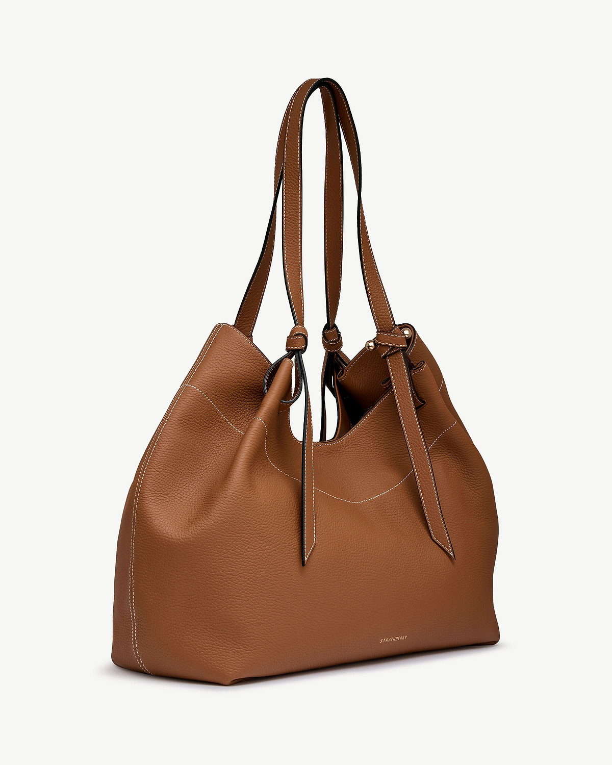 Tan pebbled leather Barra tote with knotted handles, white contrast stitching, Strathberry logo