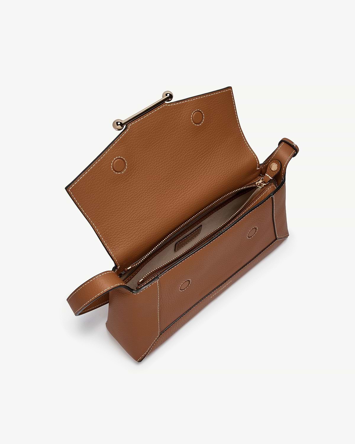 Tan mosaic shoulder bag with open flap, interior zip pocket and white stitching.