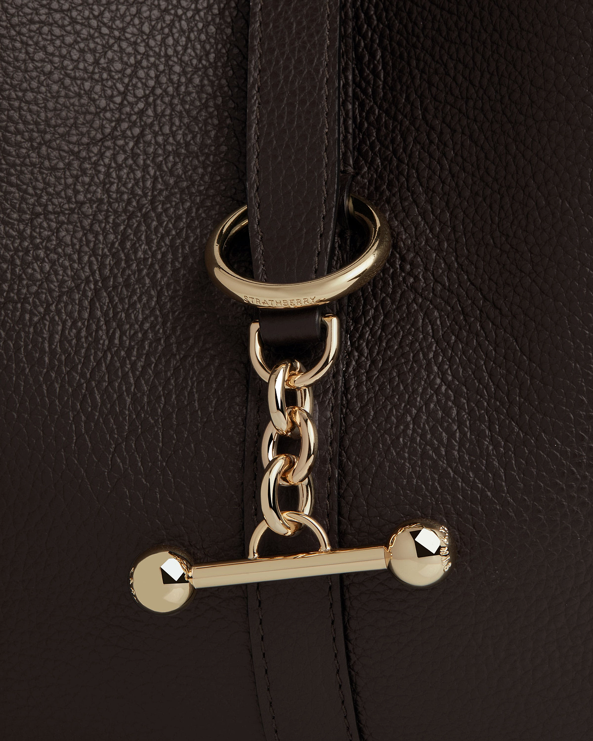 Espresso pebbled leather strap with gold chain and Strathberry engraved ring.