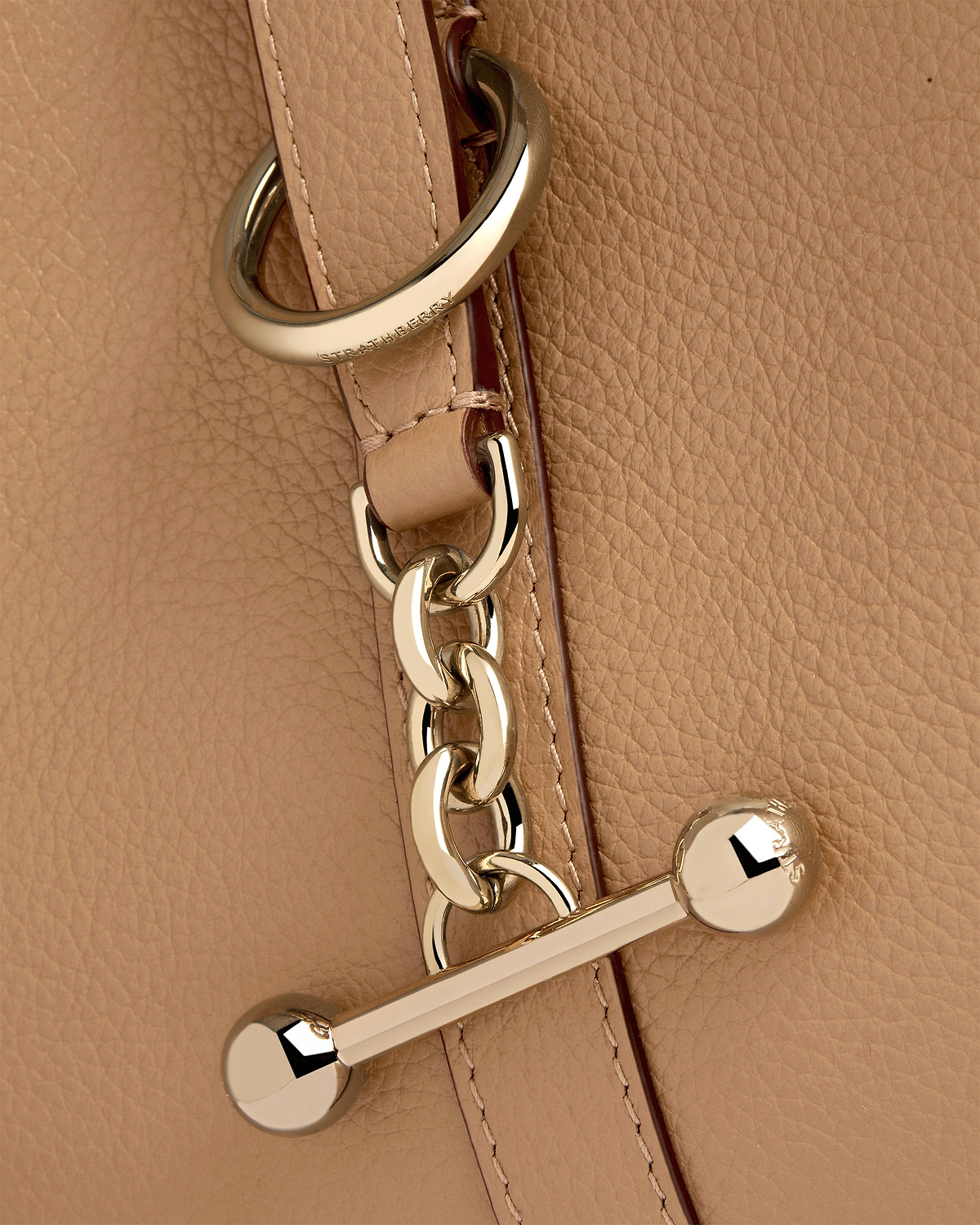 Caramel grained leather with gold chain and Strathberry engraved hardware.