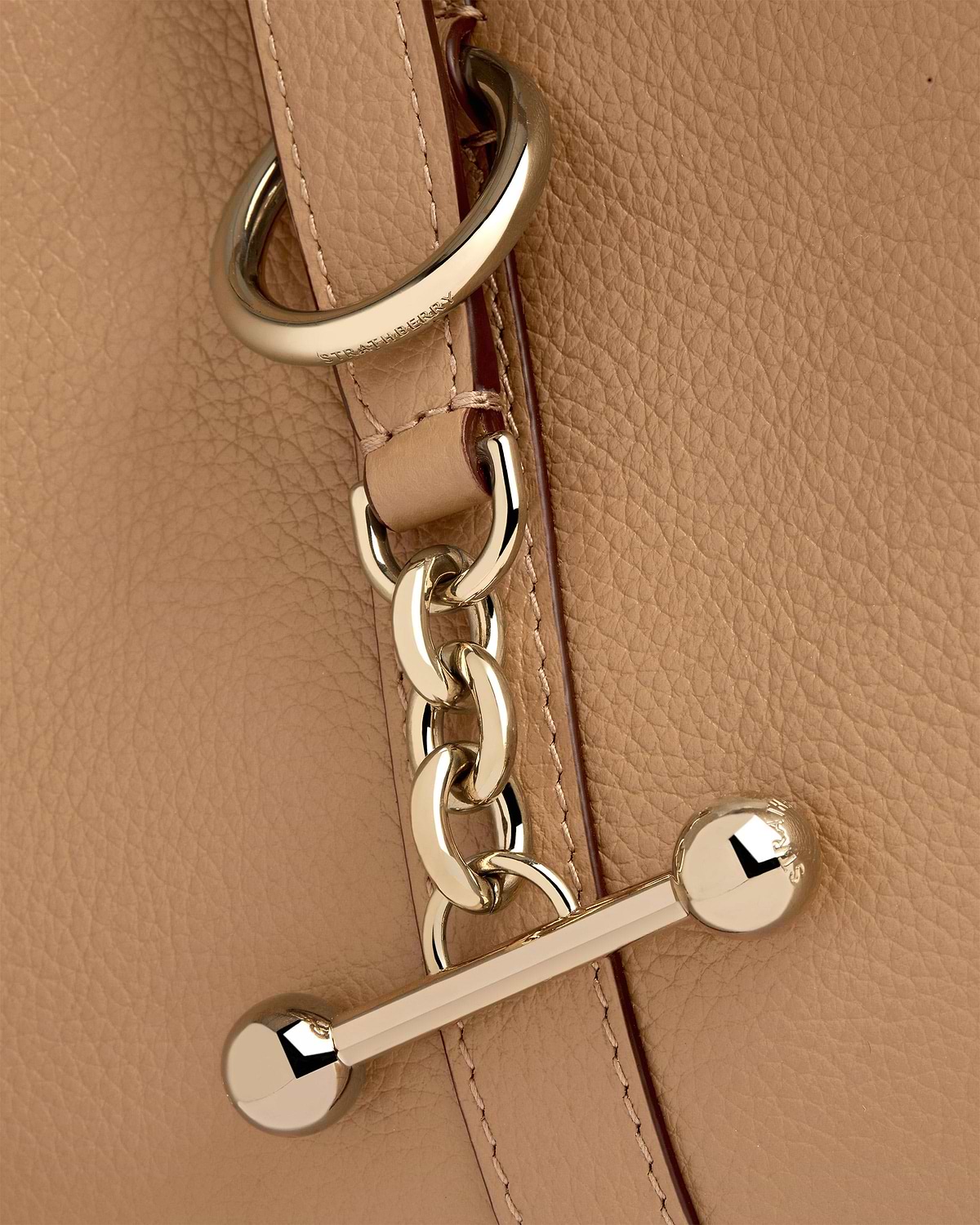 Caramel grained leather with gold chain and Strathberry engraved hardware.