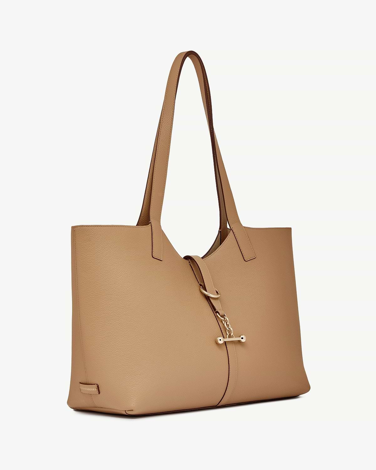 Caramel leather tote bag with long shoulder straps and gold bar fastening.
