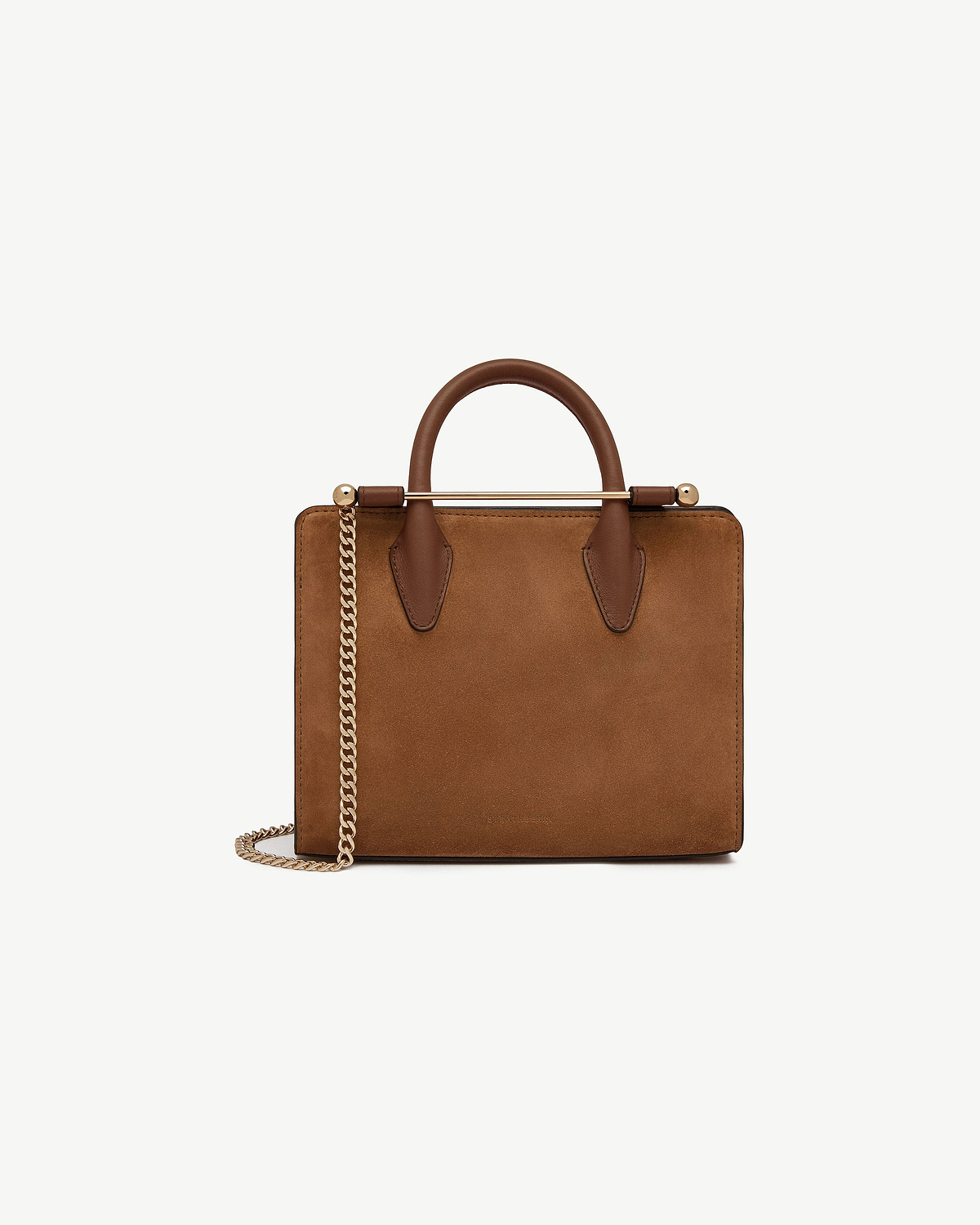 Tan suede mini tote with top handles and gold chain shoulder strap.