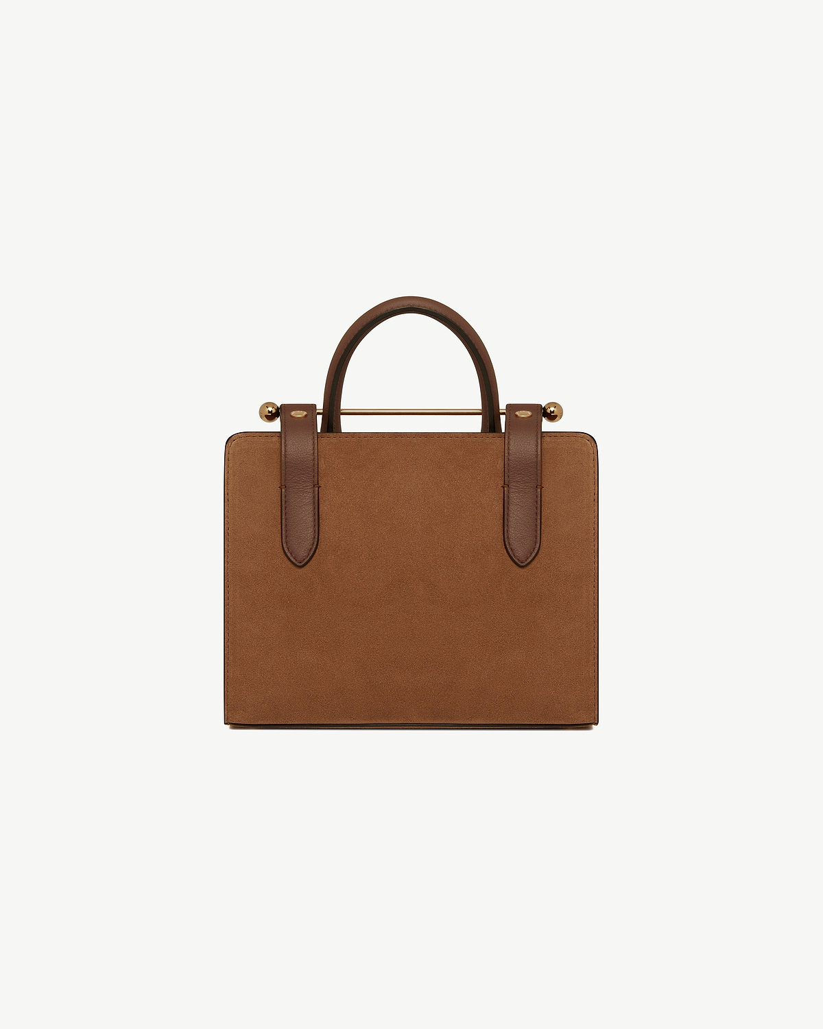 Tan suede mini tote with leather handles, strap details and gold bar hardware.