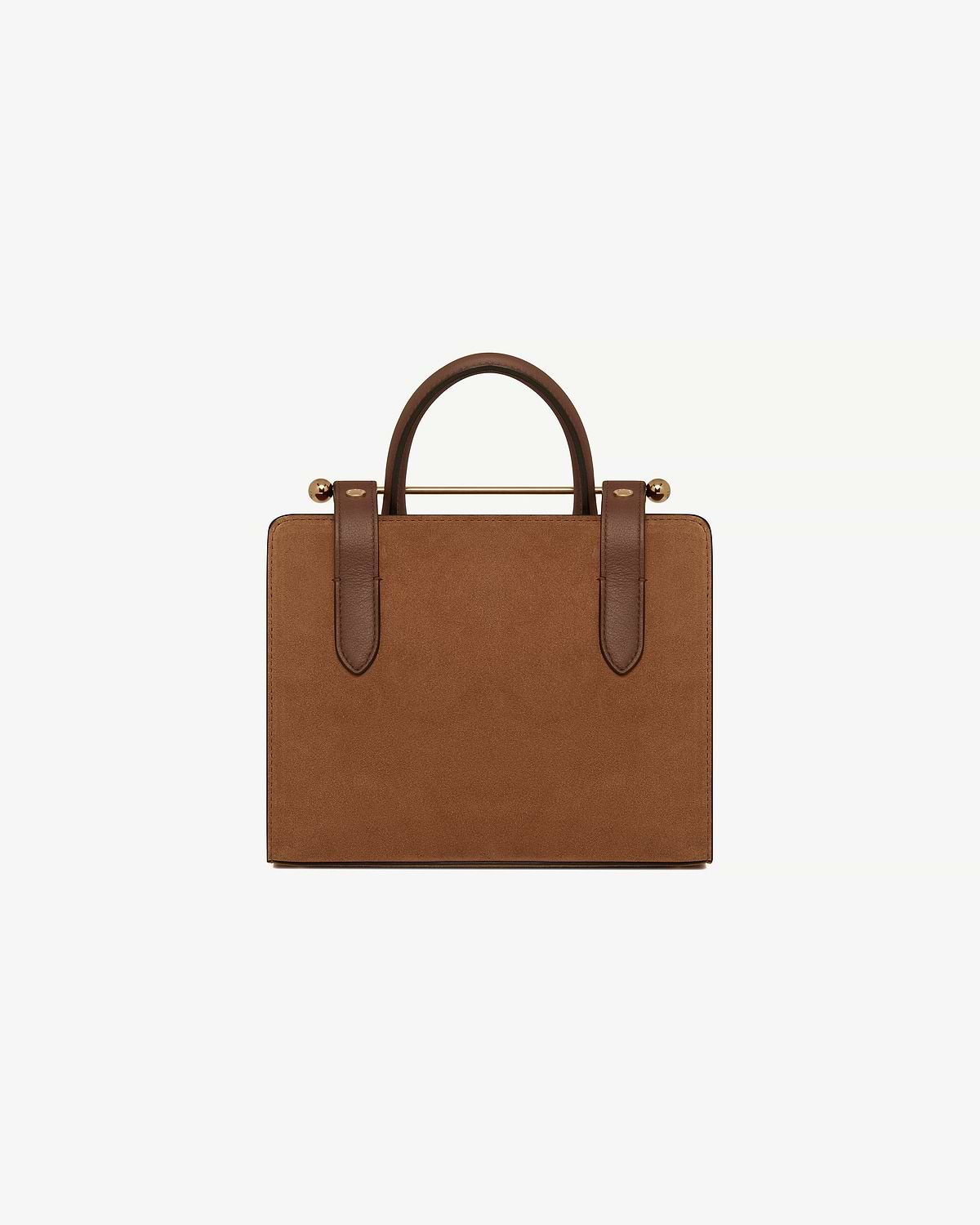 Tan suede mini tote with leather handles, strap details and gold bar hardware.