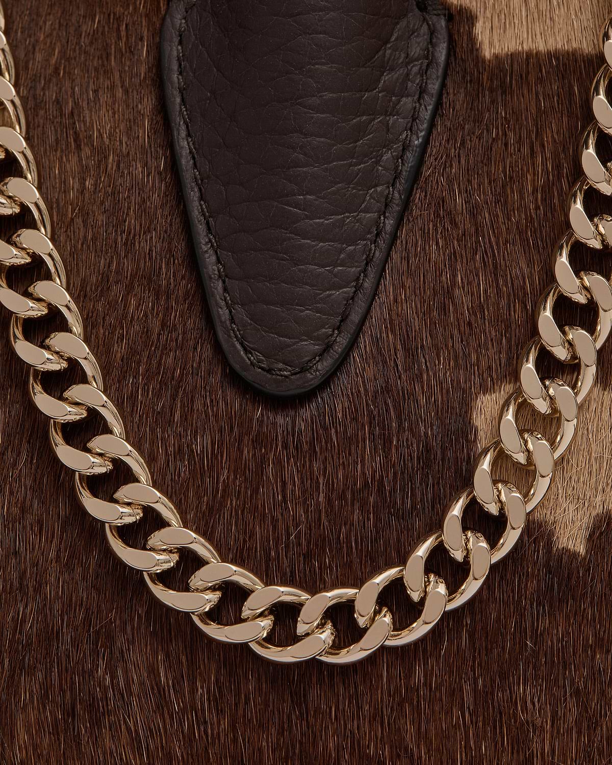 Sand and espresso spotted haircalf with dark leather trim and gold chain