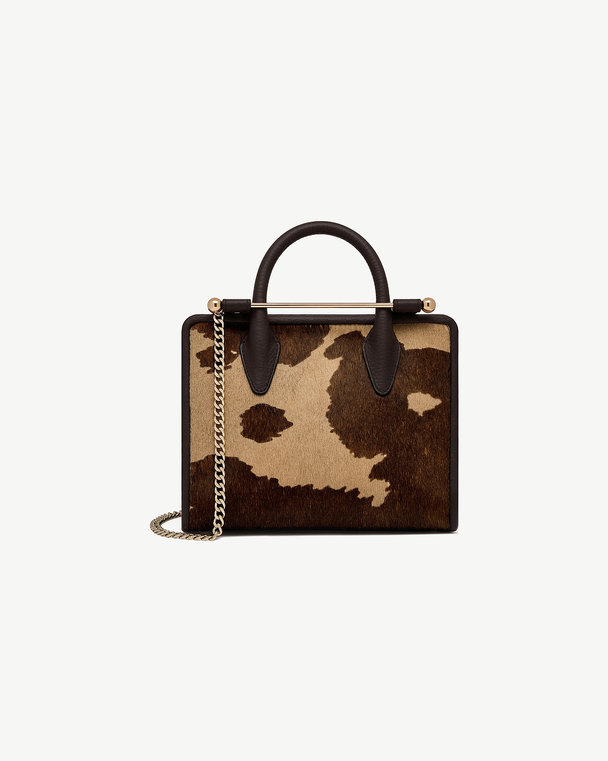 Mini tote sand and espresso spot print, dark leather handles, gold chain strap.