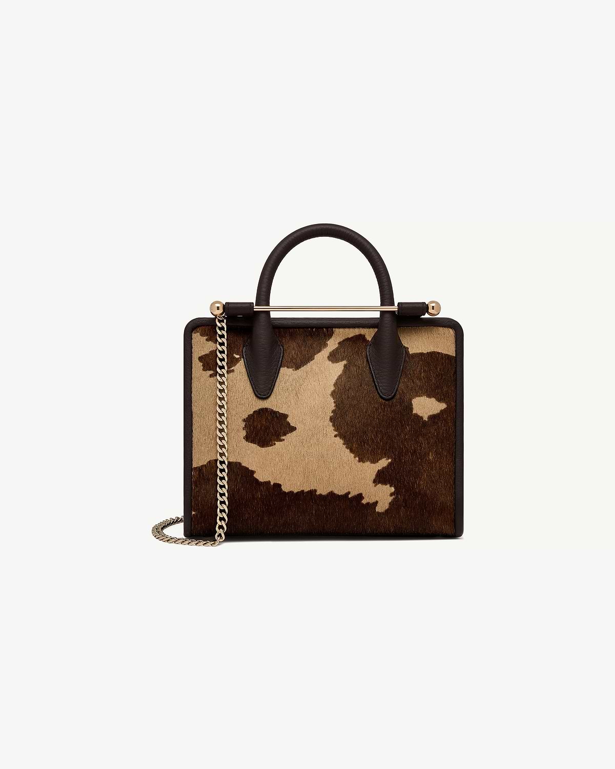 Mini tote sand and espresso spot print, dark leather handles, gold chain strap.