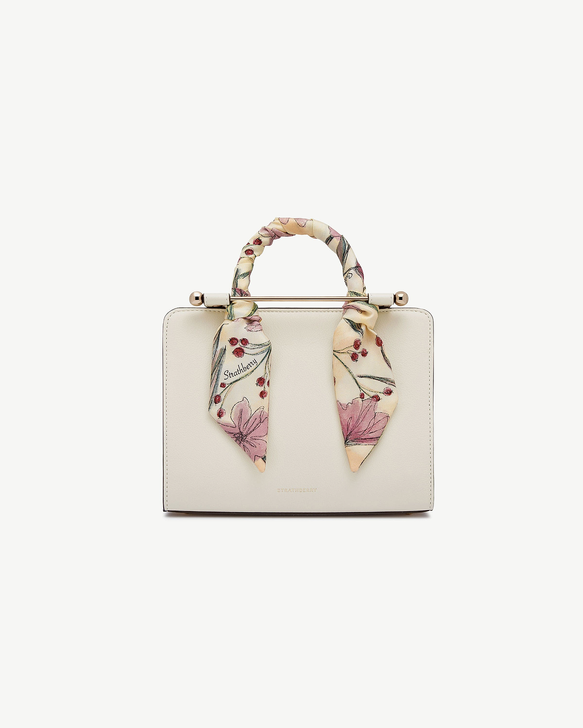 Butter yellow silk skinny scarf with berry flower print tied to Strathberry bag handle.
