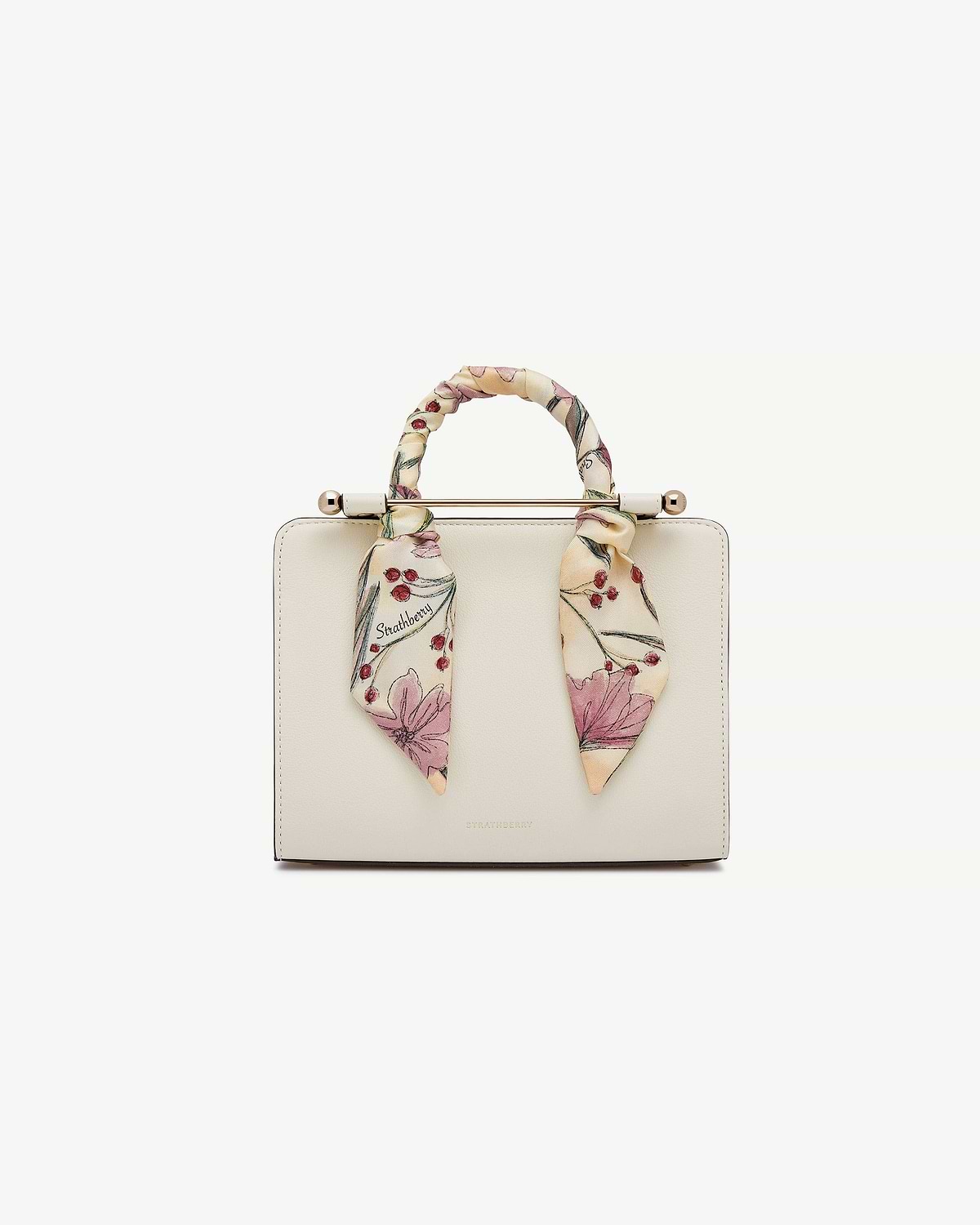 Butter yellow silk skinny scarf with berry flower print tied to Strathberry bag handle.