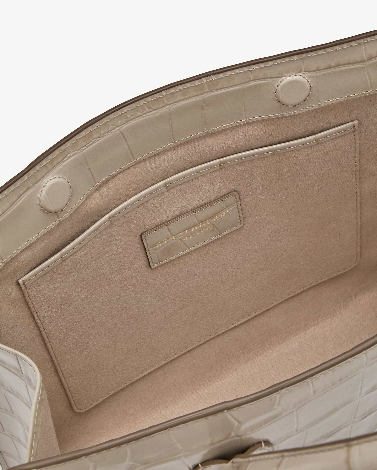 Beige croc midi tote interior with suede lining, pocket, magnetic snap, Strathberry label.