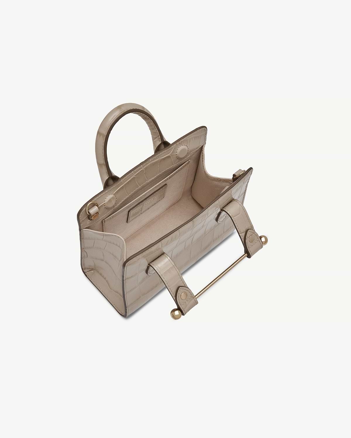 Top view of croc-effect nano tote showing open interior and metal bar handle.