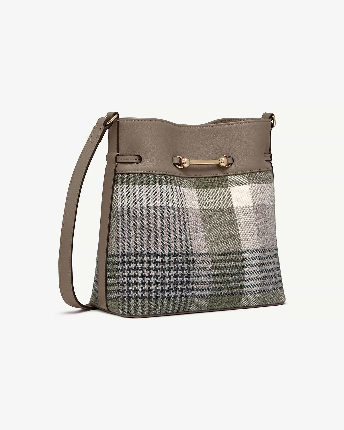 Bucket bag with tartan fabric body, taupe leather trim, gold bar hardware and shoulder strap.