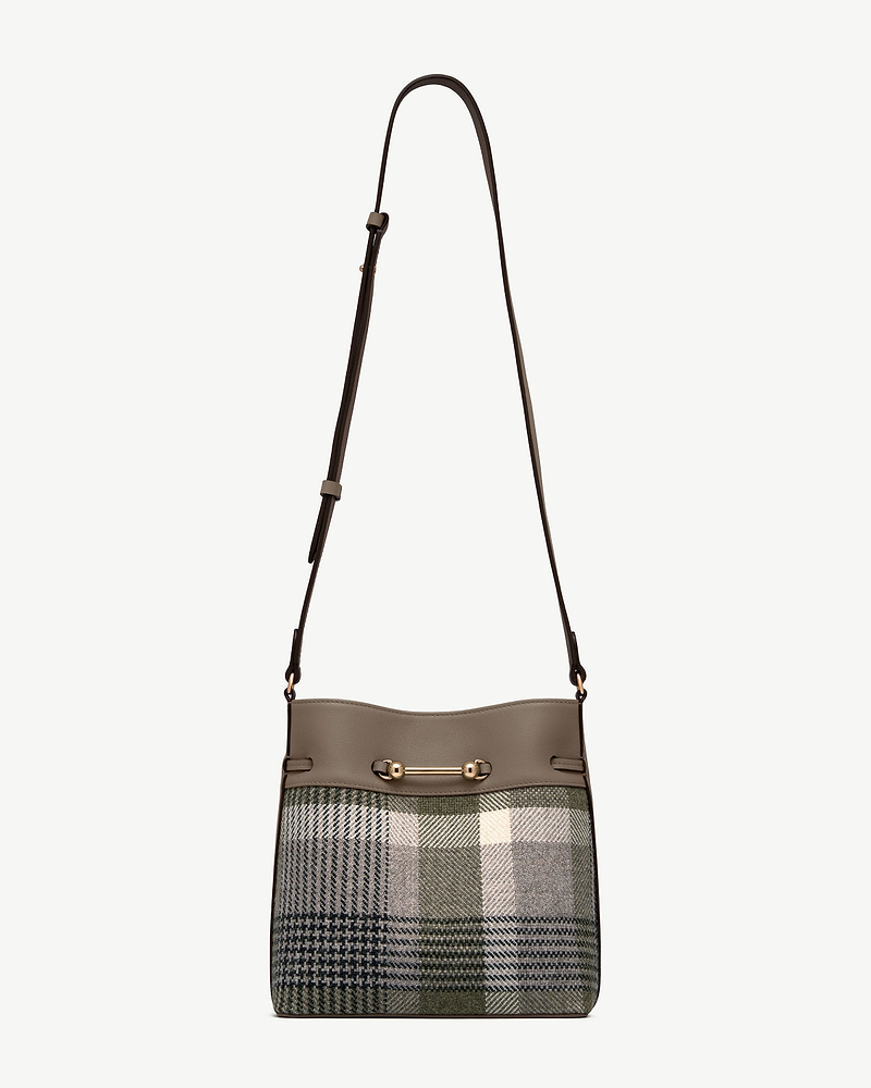 Tartan bucket bag with taupe leather trim, adjustable shoulder strap, gold bar hardware.