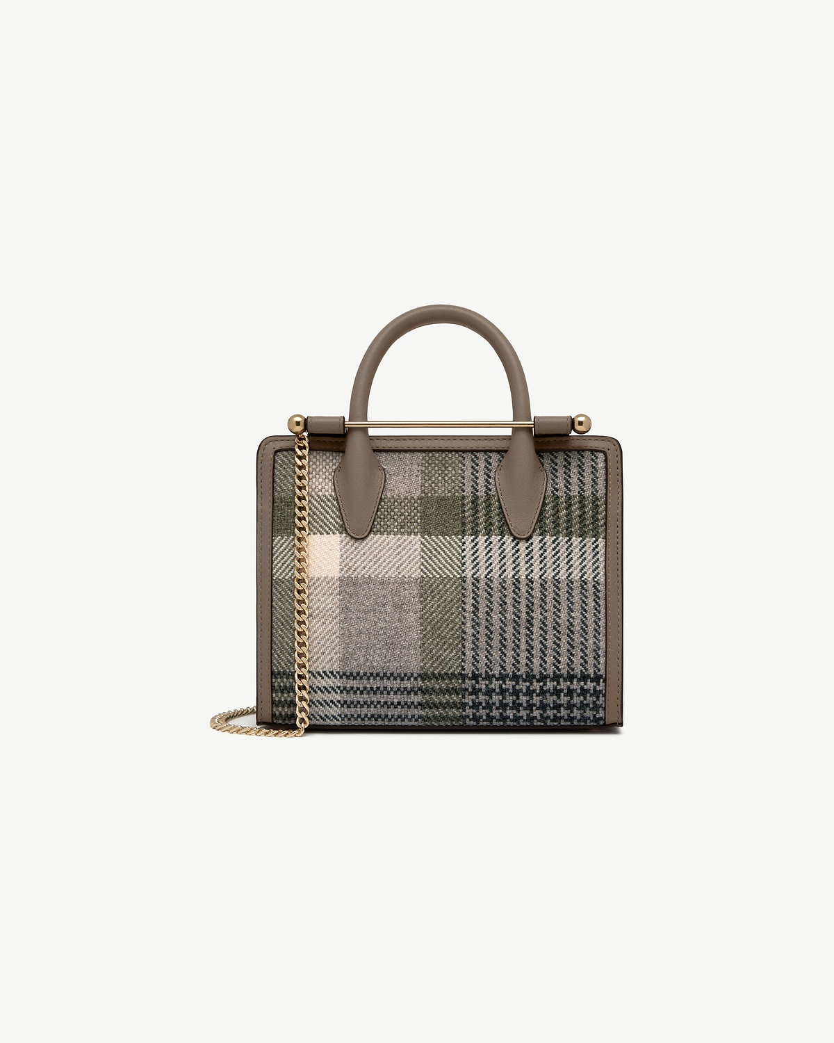 Mini tote with taupe leather trim, tartan fabric, gold bar handle and chain strap.
