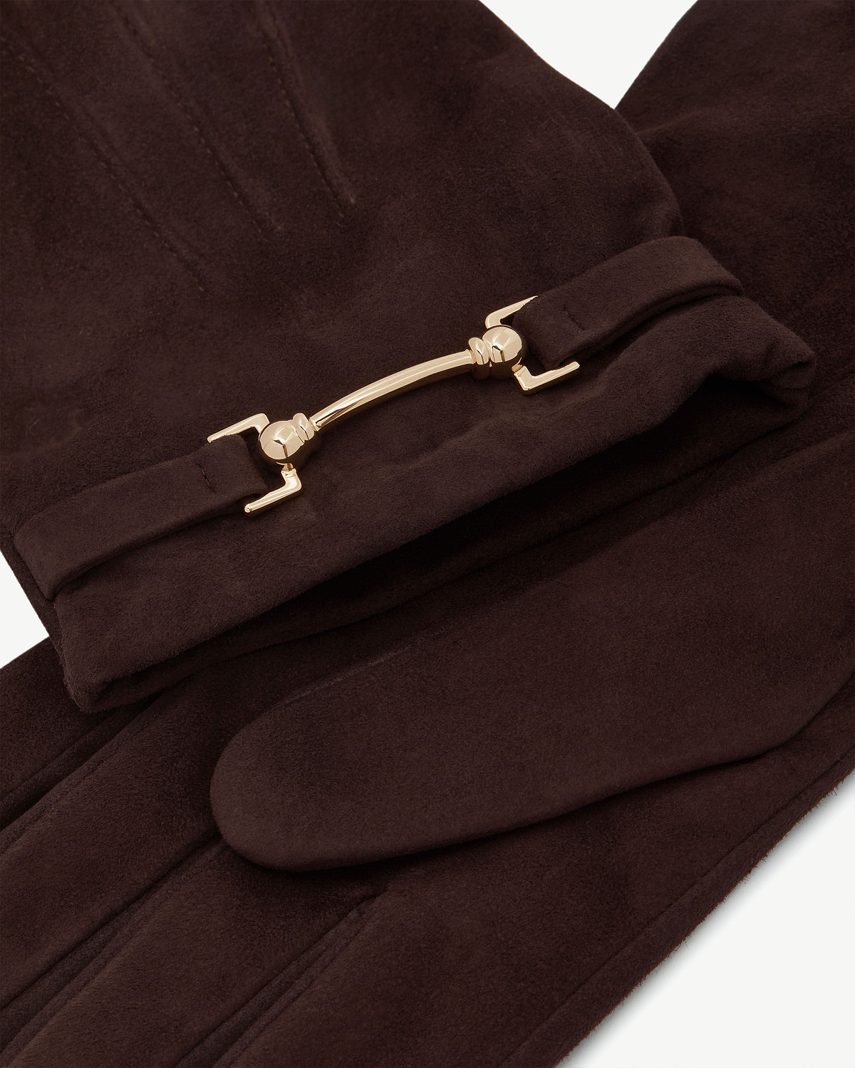Chocolate suede gloves featuring a gold metal bar detail across the wrist.