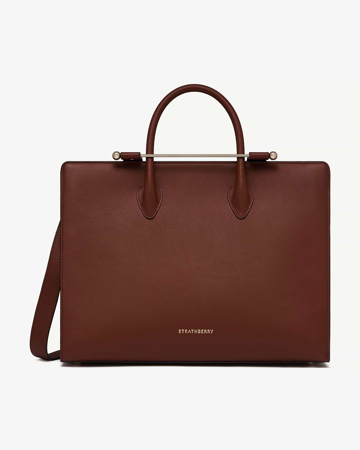Strathberry walnut leather tote with top handles and shoulder strap.