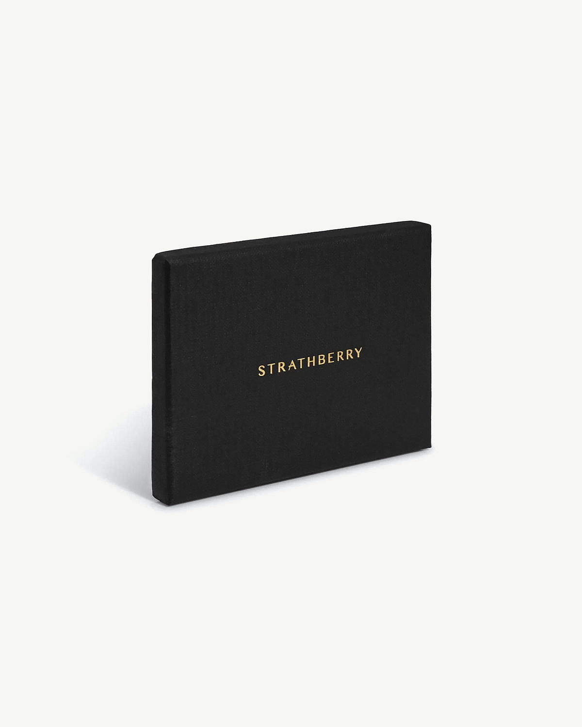 Black Strathberry presentation box standing upright with gold logo visible.