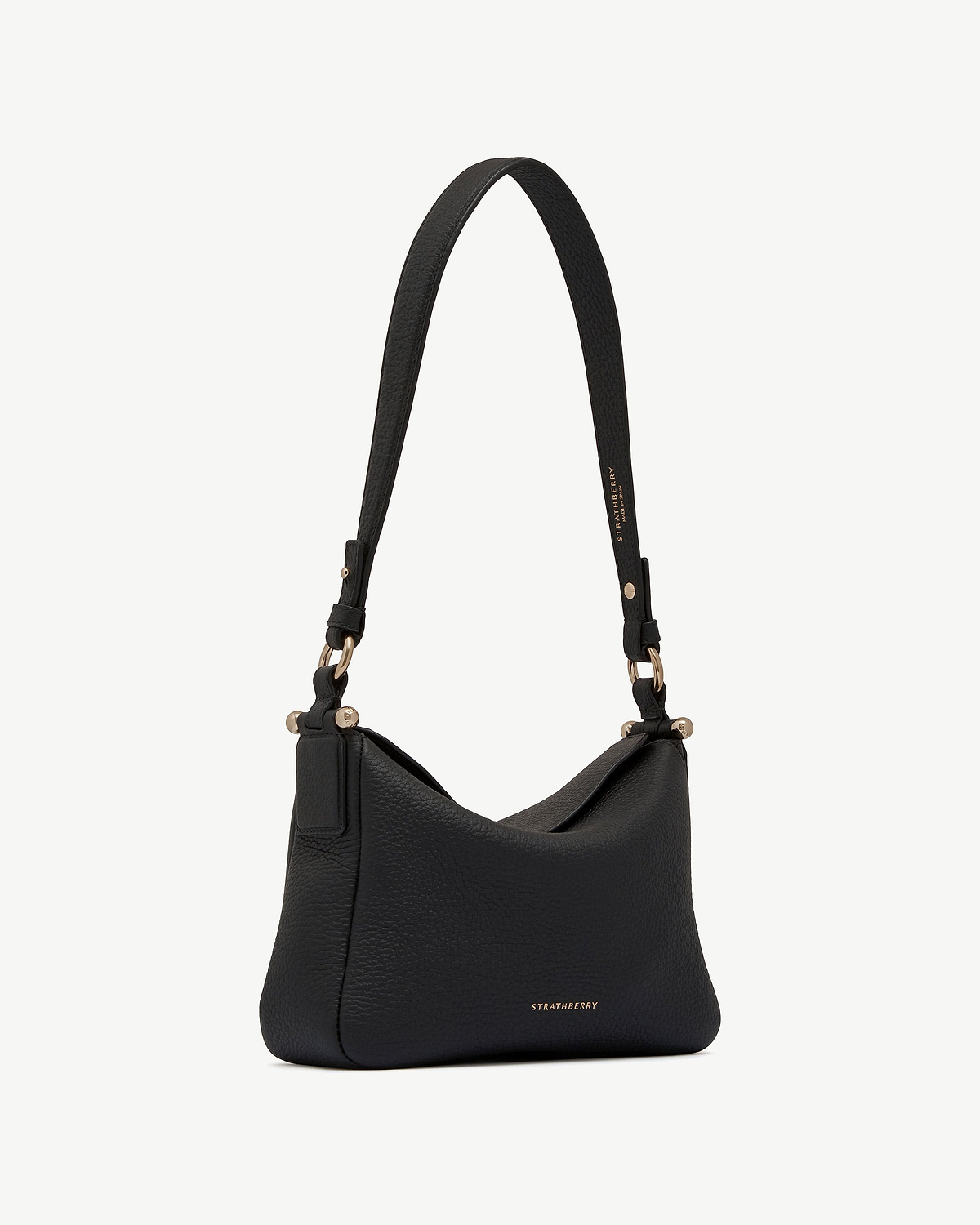 Black Sway leather shoulder bag with gold hardware and Strathberry logo.