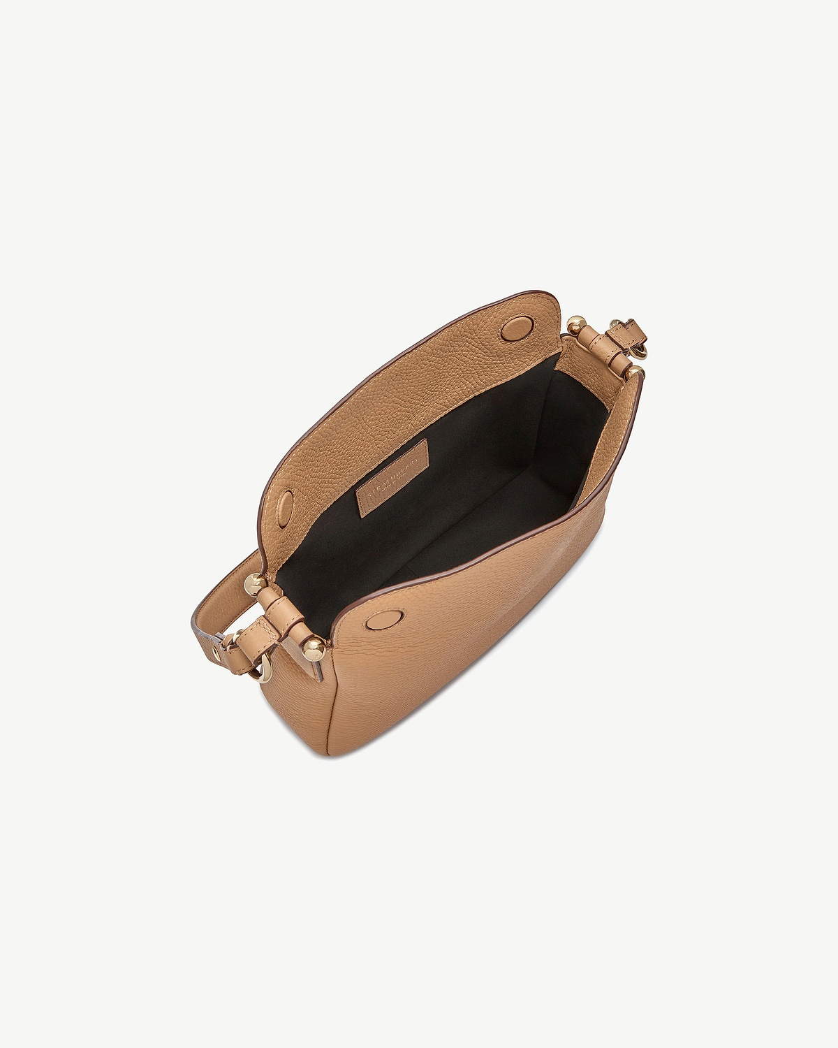 Top view of caramel Sway bag showing black lining and gold hardware.