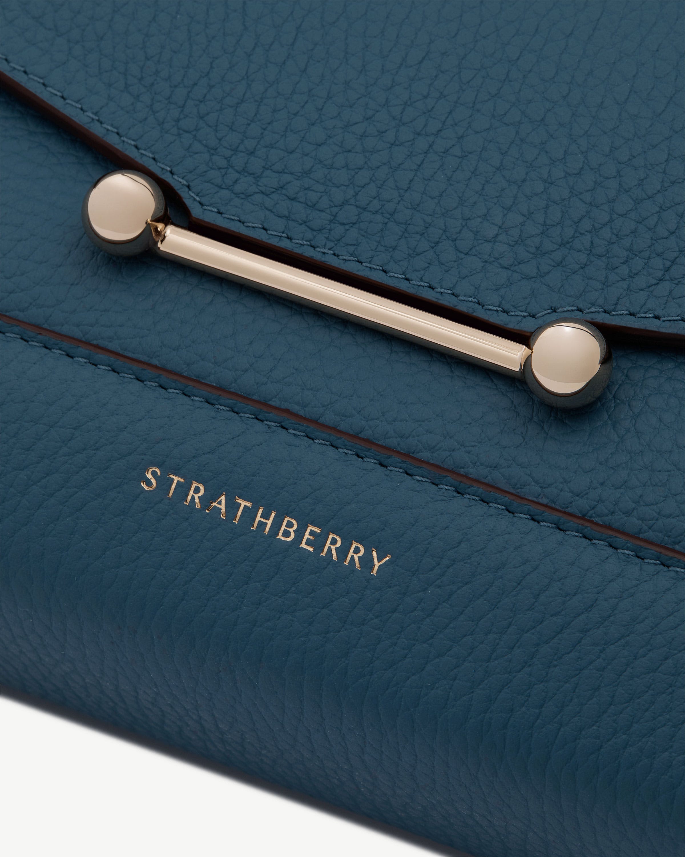 Loch blue Mosaic Shoulder pebbled leather with gold bar closure and Strathberry logo