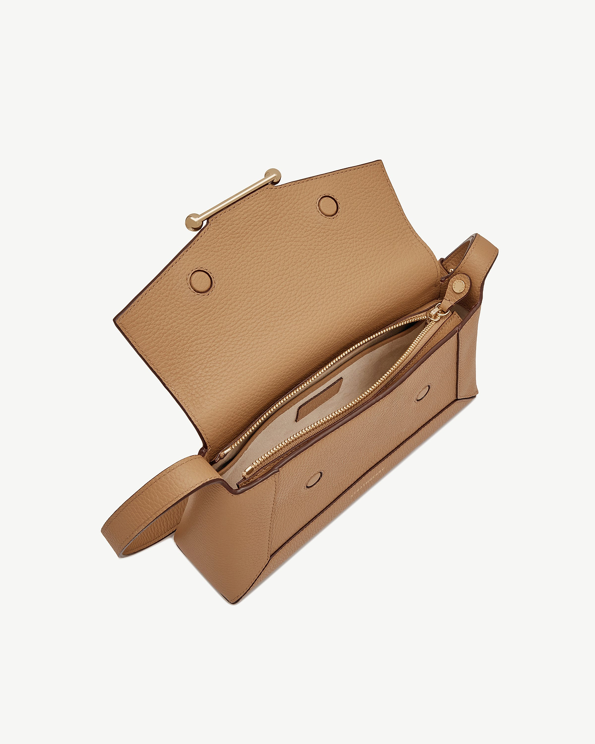 Caramel leather shoulder bag with top flap open showing zip compartment