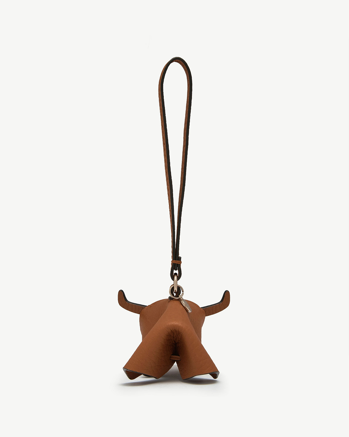 Highland cow tan leather bag charm shaped like a cow head with loop
