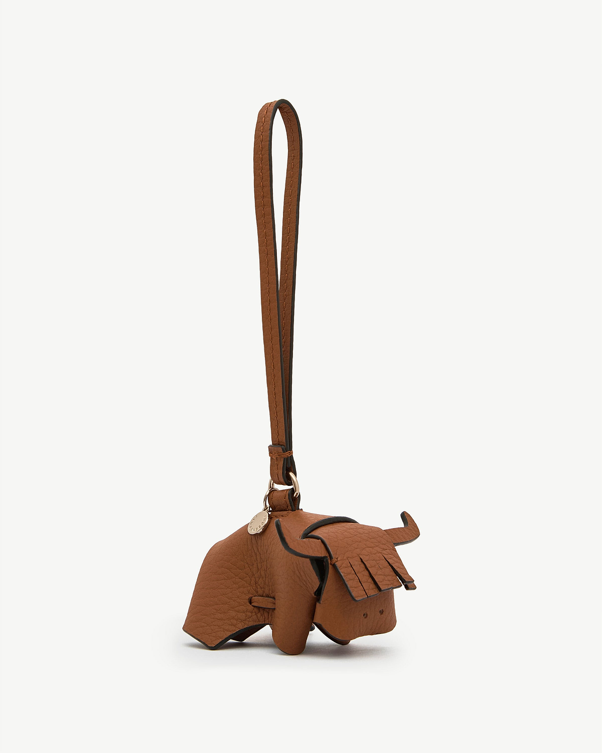 Highland cow tan leather bag charm with long strap and fringe detailing.