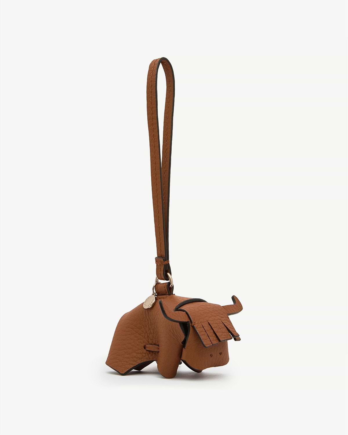 Highland cow tan leather bag charm with long strap and fringe detailing.