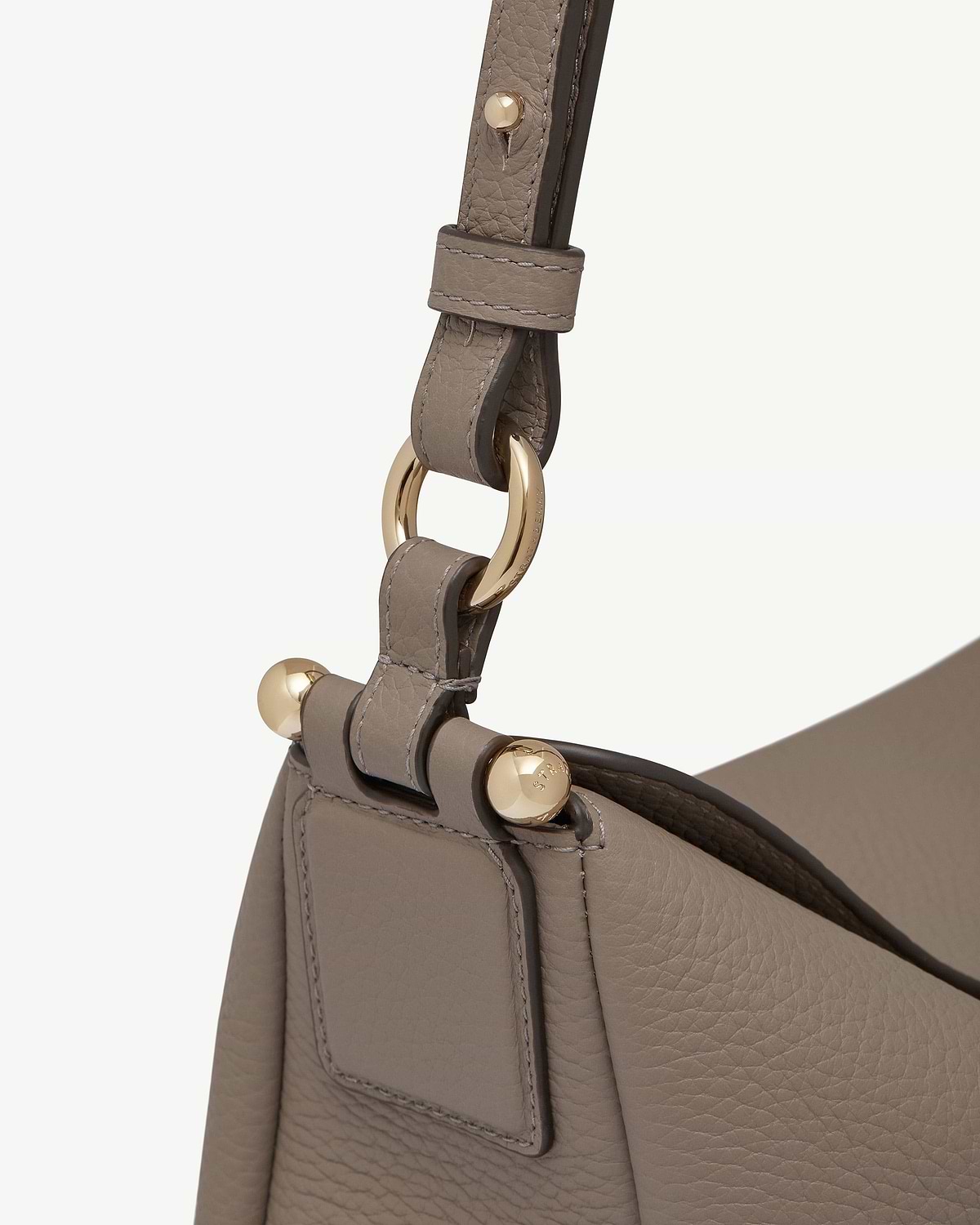 Taupe Sway Maxi leather strap with gold ring and stud hardware.