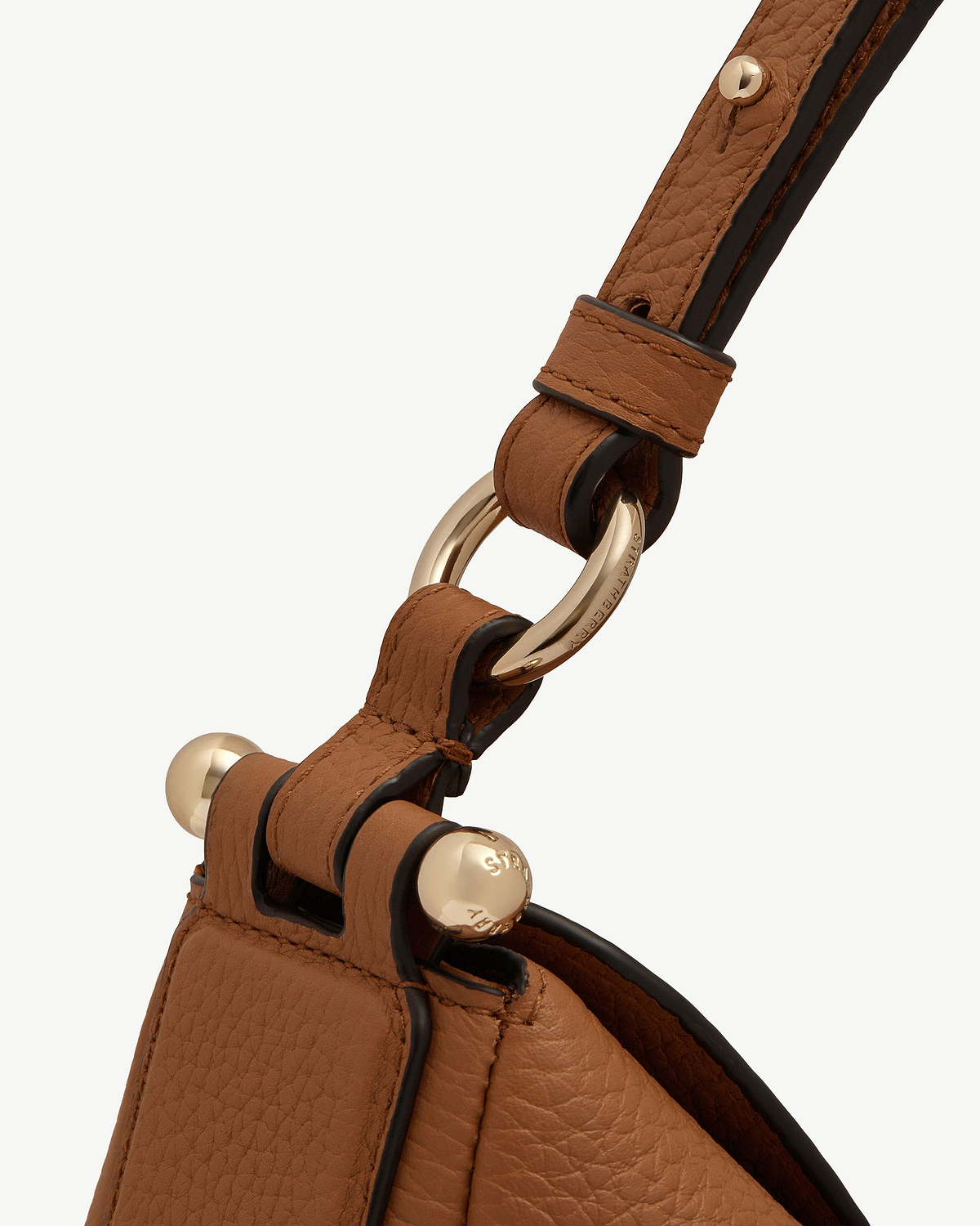 Tan Sway Maxi leather strap with gold ring hardware engraved Strathberry.