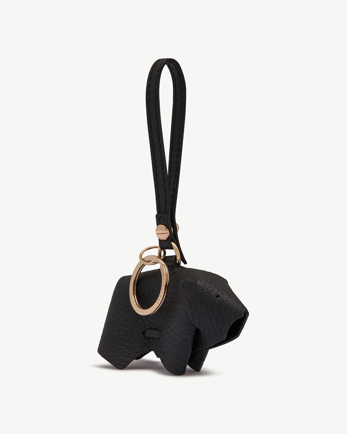 Black leather bear bag charm with wrist strap and gold key ring.