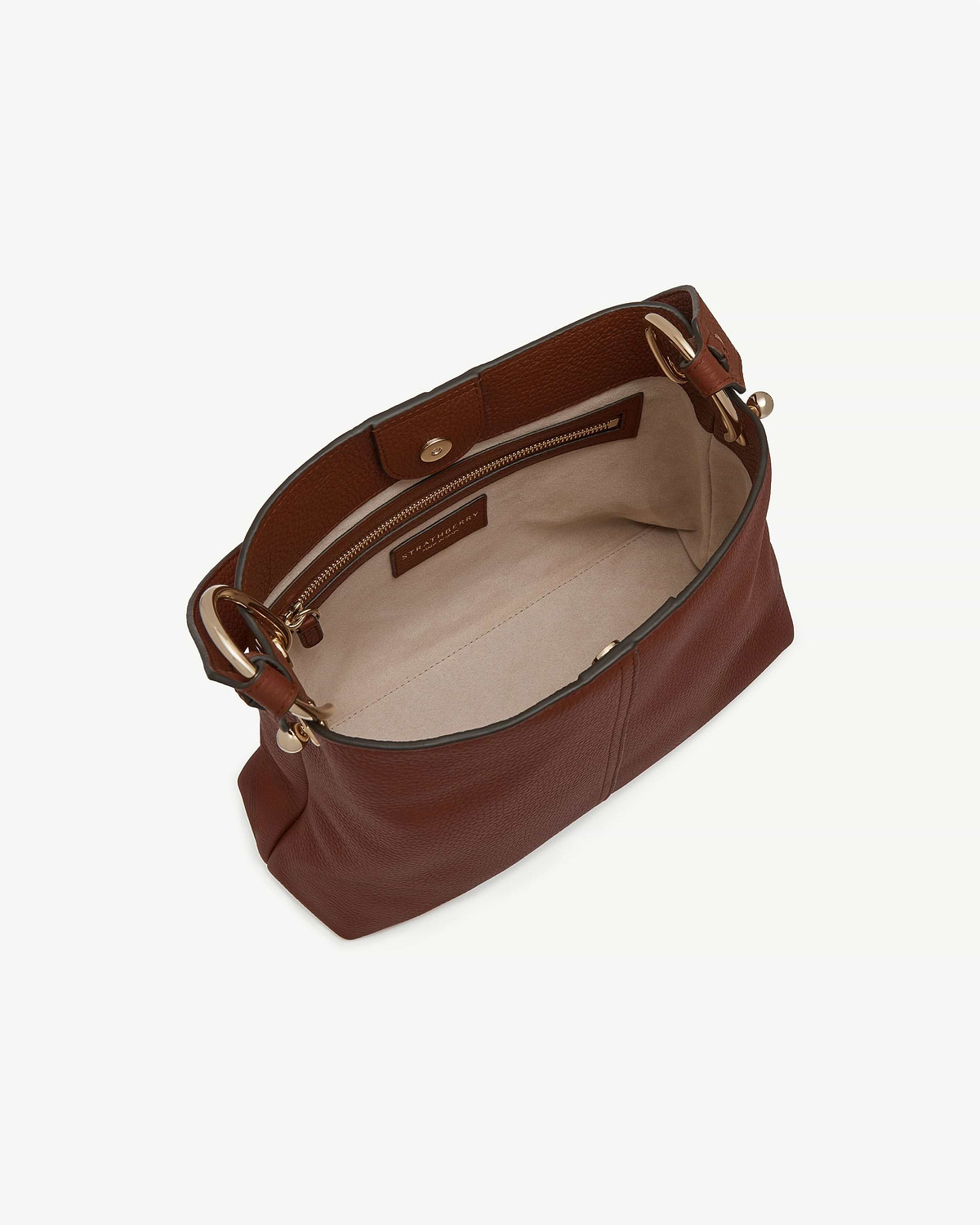 Walnut Lana Hobo bag interior with zip pocket, gold rings and Strathberry label.