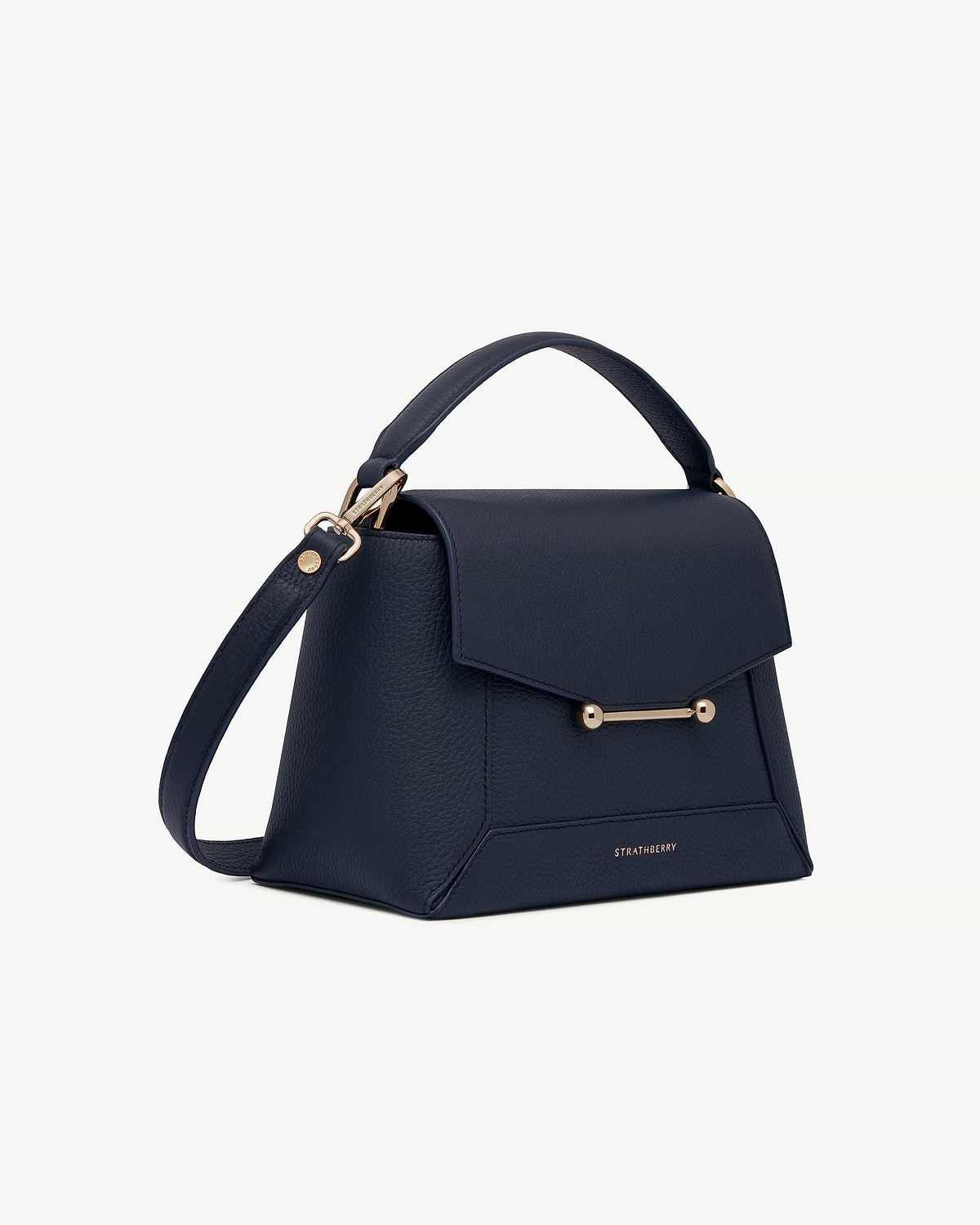 Navy mosaic bag with top handle, shoulder strap and gold bar closure, Strathberry.